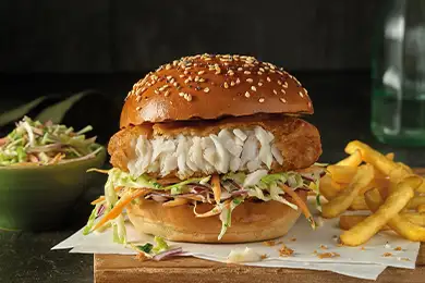 Quarter-pound battered fish fillet served in a burger bun with fries.