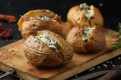 Crispy jacket potatoes generously filled and served on a sharing platter.