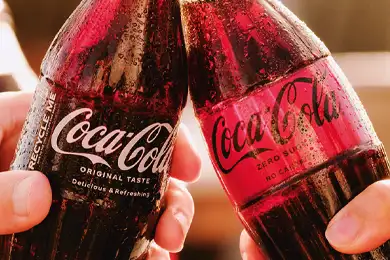 Clinking glasses of Coca-Cola.